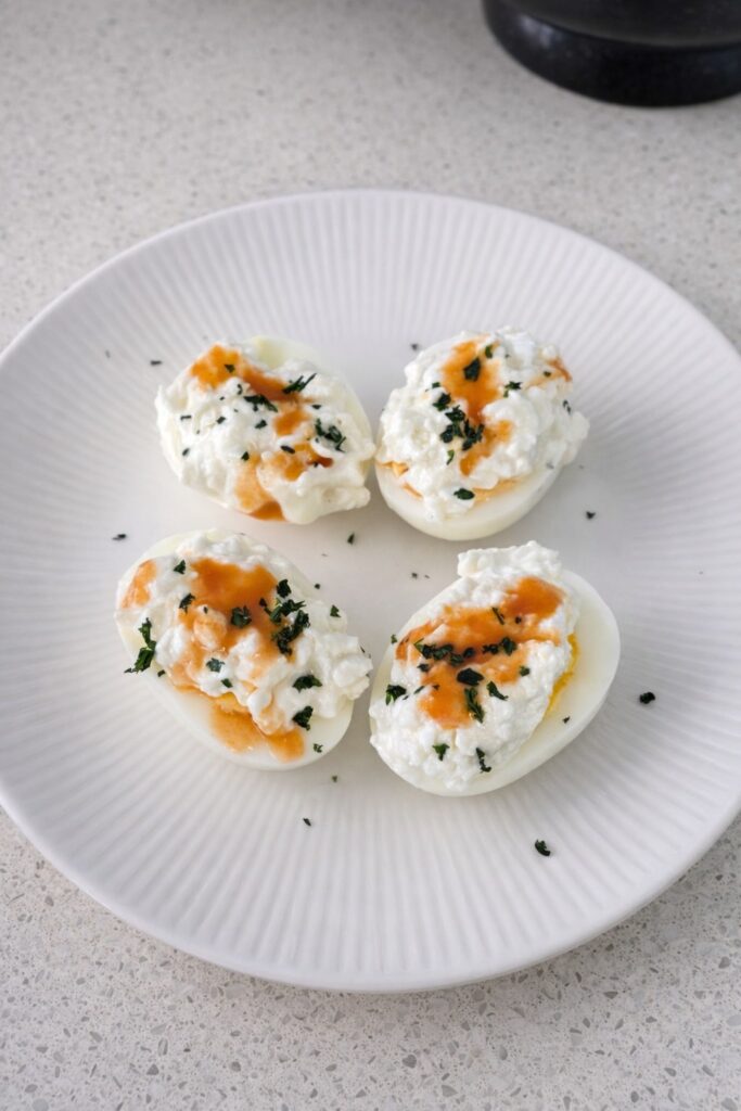 Boiled Eggs with Cottage Cheese and Hot Sauce