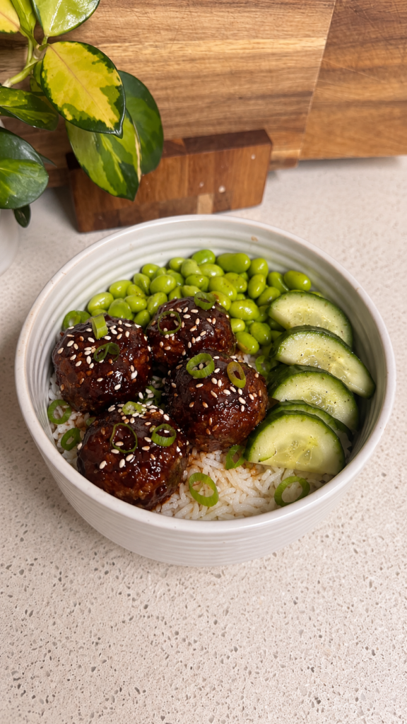 Sticky BBQ beef meatballs on rice with edamame and cucumber